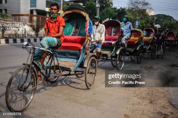 Rickshaw pullers are waiting for the food aid that were distributed in dhaka city today. With new 341 infected people in last 24 hours, the total...