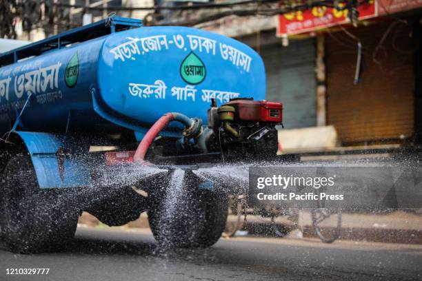 Water carrying car is spraying disinfectant in the streets of dhaka to keep city clean and safe from novel coronavirus . With new 341 infected people...