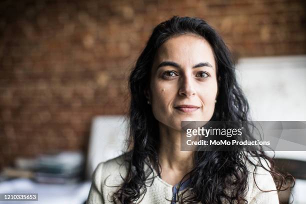 portrait of businesswoman in creative office - looking at camera stock pictures, royalty-free photos & images