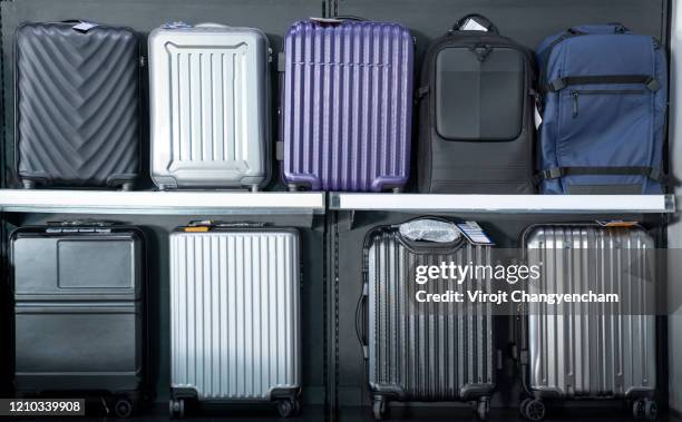 many travel luggage on the shelf - suitcase from above imagens e fotografias de stock
