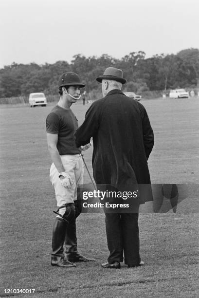 Charles, Prince of Wales with Louis Mountbatten, 1st Earl Mountbatten of Burma at the home of the Guard's Polo Club, at Smith's Lawn, Windsor Great...