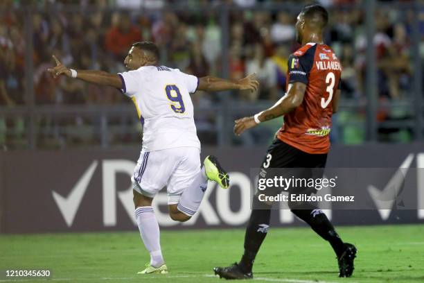 Ramon Abila of Boca Juniors celebrates after scoring the first goal of his team during a Group H match between Caracas and Boca Juniors as part of...