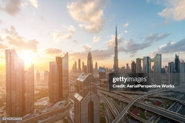 aerial view of dubai skyline at sunrise - arial view dubai skyline stock pictures, royalty-free photos & images