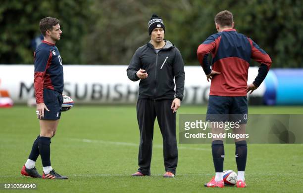 Jonny Wilkinson speaks to George Ford and Owen Farrell of England during a training session ahead of their Guinness Six Nations match against Wales...