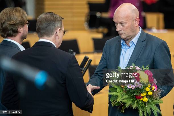 Bodo Ramelow, leader of the left-wing Die Linke political party in Thuringia is congratulated by Thomas Kemmerich of FDP after being elected new...