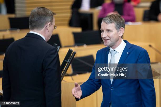 Bjoern Hoecke, leader of the right-wing Alternative for Germany congratulate Bodo Ramelow, leader of the left-wing Die Linke political party in...