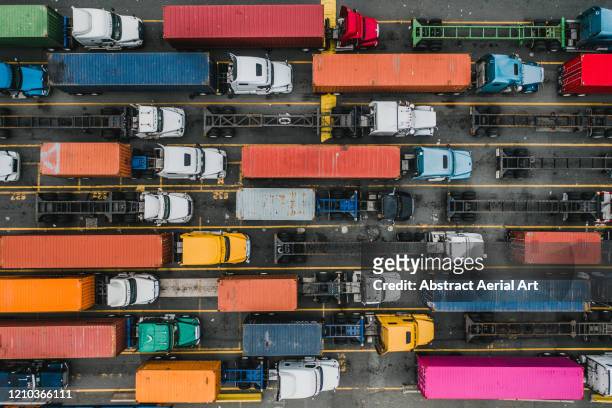 aerial shot above a variety of freight trucks, new jersey, united states of america - delivery truck stock-fotos und bilder