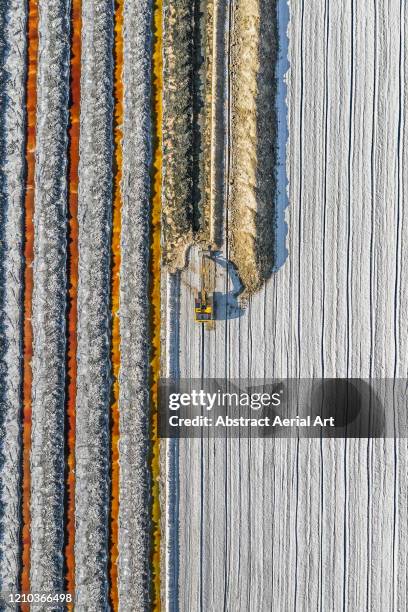 progress of an excavator working in a salt mine as seen from directly above, california, united states of america - salt mineral stock-fotos und bilder