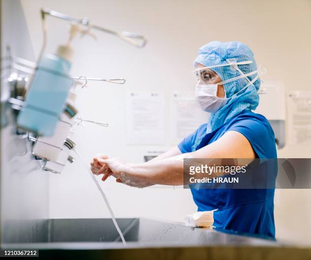 Healthcare worker doing sanitation of hands.