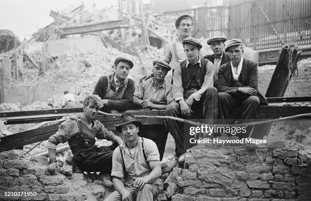Demolition crew at a site near the offices of Picture Post magazine in Shoe Lane, off Fleet Street, London, September 1941. Buildings in the area...