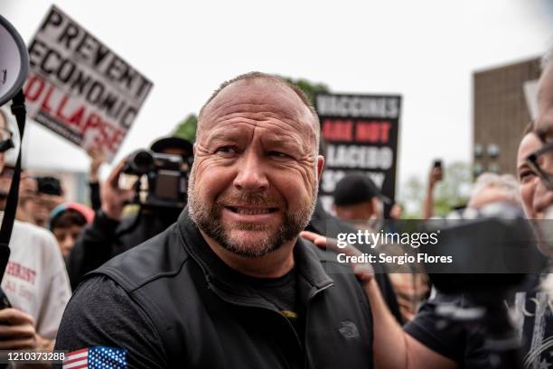 Infowars founder Alex Jones interacts with supporters at the Texas State Capital building on April 18, 2020 in Austin, Texas. The protest was...