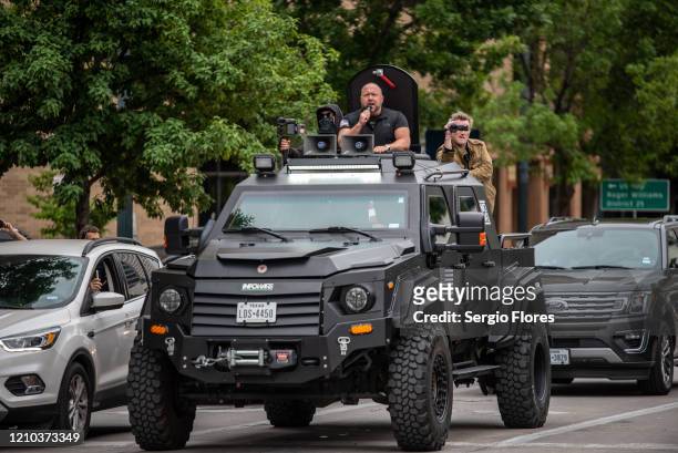 Infowars host Alex Jones arrives at the Texas State Capital building on April 18, 2020 in Austin, Texas. The protest was organized by Infowars host...