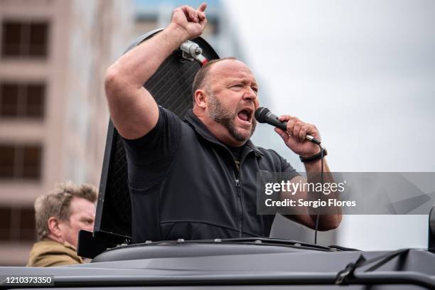 Infowars host Alex Jones arrives at the Texas State Capital building on April 18, 2020 in Austin, Texas. The protest was organized by Infowars host...