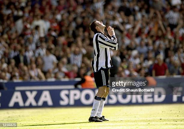 Duncan Ferguson of Newcastle United is praying for a miracle during the AXA FA Cup Final match against Manchester United played at Wembley Stadium in...