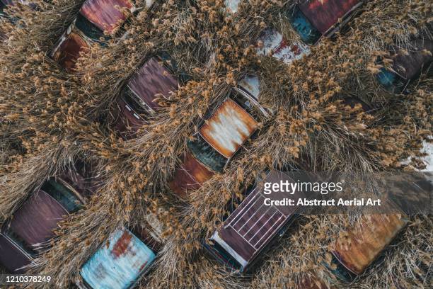 close up aerial shot of abandoned cars, utah, united states of america - rusty old car fotografías e imágenes de stock