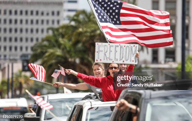 Demonstrators protest during a "Freedom Rally" against Stay-At-Home Directives on April 18, 2020 in San Diego, California. Rallies were held at...