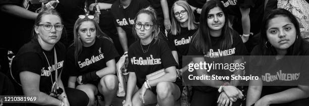 Portrait of a group of girls, all in matching t-shirts that read 'End Gun Violence,' as they pose together during a rally, Washington DC, September...