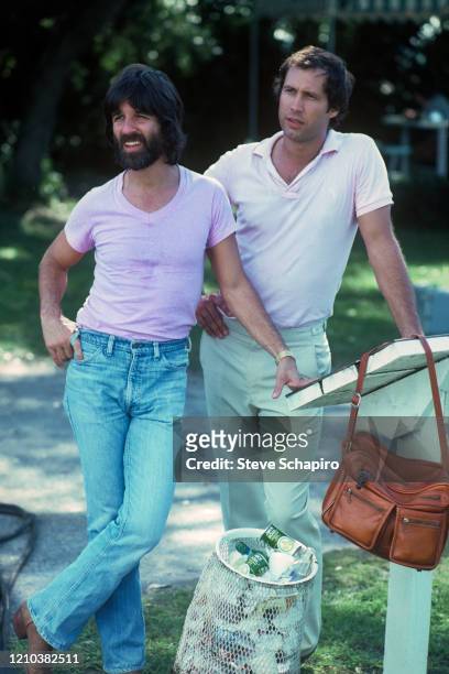 View of American producer Jon Peters and actor & comedian Chevy Chase during the filming of 'Caddyshack' , Sarasota, Florida, 1979.