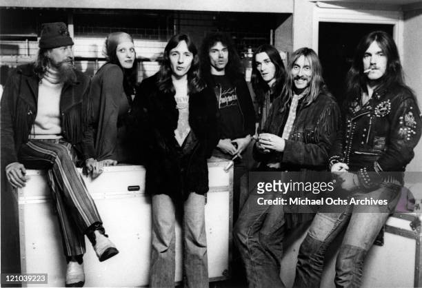 Nik Turner, Stacia, Alan Powell , Simon House, Simon King, Dave Brock, and Lemmy Kilmister of the space rock band "Hawkwind" pose for a portrait in...