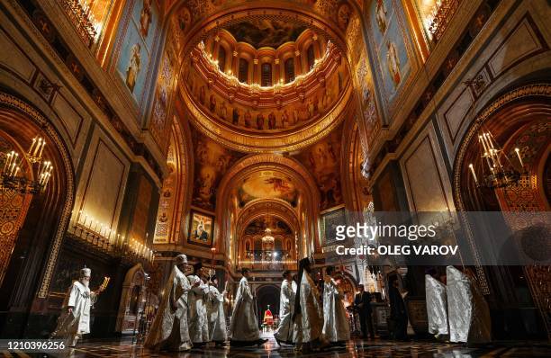 Russian Orthodox Patriarch Kirill celebrate the Easter service in the Christ the Savior Cathedral in Moscow early morning on April 19 during a strict...