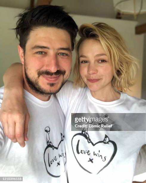 Marcus Mumford and Carey Mulligan, wearing a limited-edition t-shirt created in collaboration with Charlie Mackesy featuring his beloved characters,...