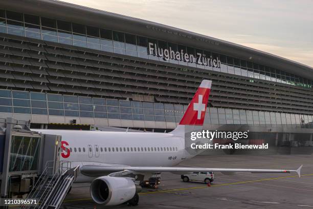 The mail hall of Zurich Airport, an airplane of Swiss International Air Lines parked in front.