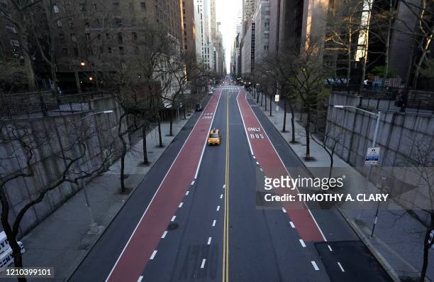 Deserted 42nd Street is seen in midtown New York on April 19, 2020 during the COVID-19, coronavirus epidemic. - This week, Governor Andrew Cuomo...