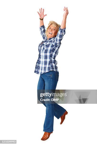 woman excitedly jumping in the air - isolated - arms raised isolated stock pictures, royalty-free photos & images