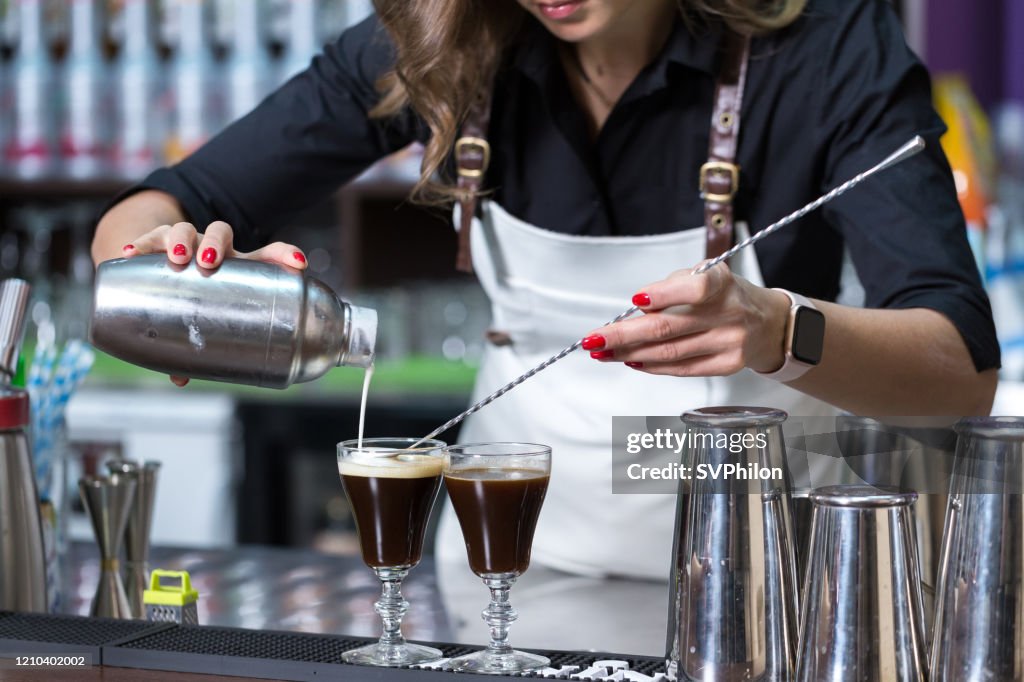 Professional bartender makes a cocktail.