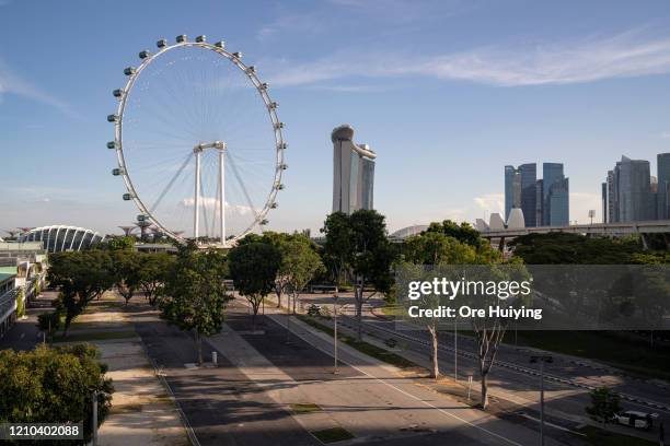 General view of empty roads during a "Circuit Breaker" with the Singapore Flyer in the background on April 19, 2020 in Singapore.