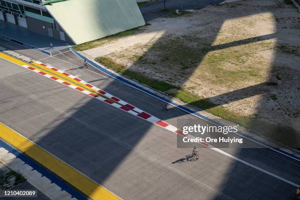 People can be seen exercising at the Marina Promenade during a "Circuit Breaker" on April 19, 2020 in Singapore.