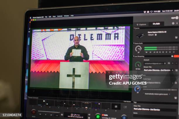 Computer screen shows Pastor Tim Thompson leading an online Sunday Service at the Christian '412 Church Murrieta' on April 19, 2020 in Murrieta,...