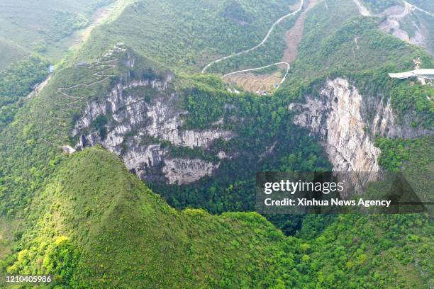 April 19, 2020 -- Aerial Photo taken on April 19, 2020 shows the scenery of Dashiwei Tiankeng, a giant karst sinkhole, at Leye-Fengshan Global...