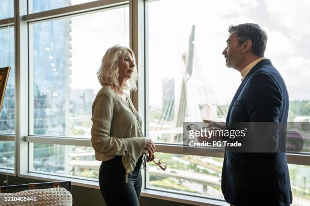 business partners talking at office - employee conflict stock pictures, royalty-free photos & images