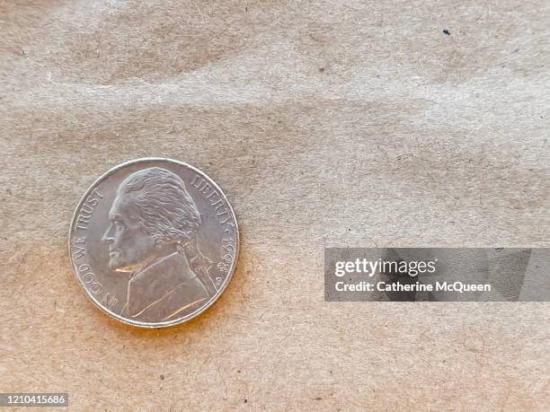 brown paper bag background and u.s. nickel - five cent coin stock pictures, royalty-free photos & images