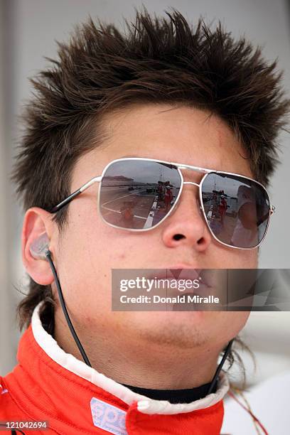 Sebastian Saavedra of Colombia, driver of the Bogota Es Mundial Conquest Racing Dallara Honda, looks on from the pits during practice for the IZOD...