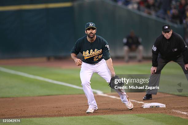 Conor Jackson of the Oakland Athletics fields during the game against the Minnesota Twins at the Oakland-Alameda County Coliseum on July 29, 2011 in...