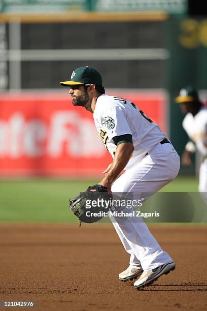 Conor Jackson of the Oakland Athletics fields during the game against the Minnesota Twins at the Oakland-Alameda County Coliseum on July 30, 2011 in...