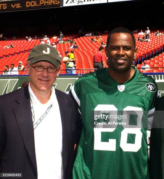 Musician Brian McKnight meets with New York Jets owner Woody Johnson when he performs The National Anthem when he attends the New York Jets vs Miami...