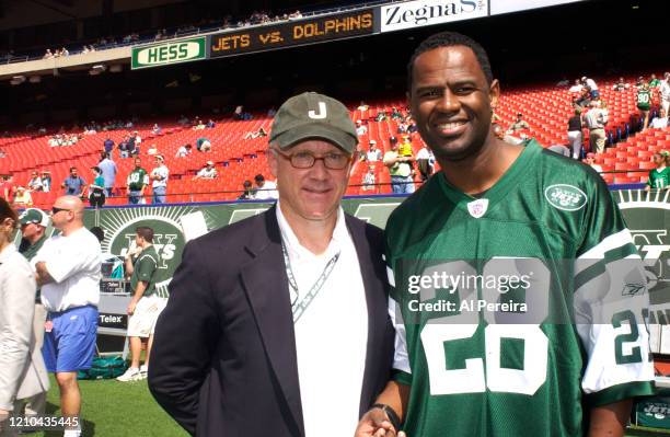 Musician Brian McKnight meets with New York Jets owner Woody Johnson when he performs The National Anthem when he attends the New York Jets vs Miami...