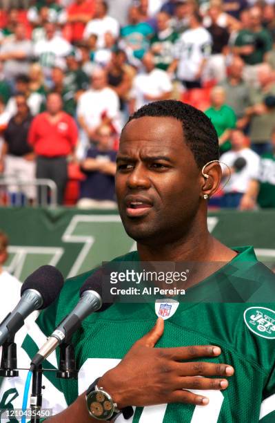 Musician Brian McKnight performs The National Anthem when he attends the New York Jets vs Miami Dolphins game at The Meadowlands on September 14,...