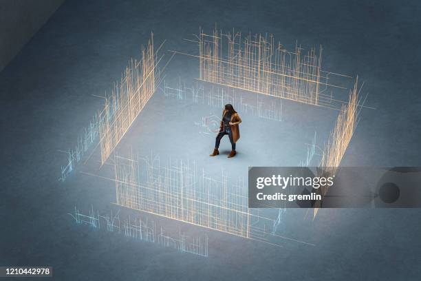 young woman standing against city with augmented reality directions - surrounding stock pictures, royalty-free photos & images