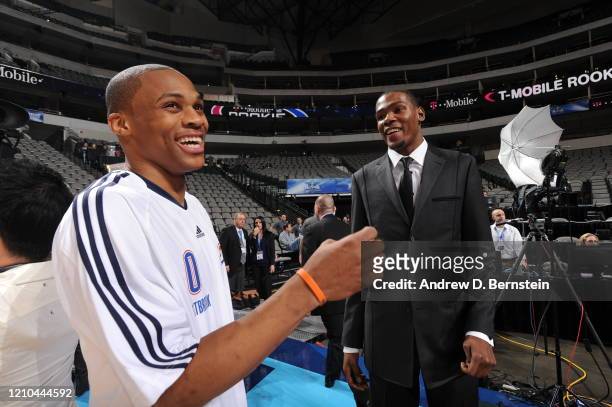 Russell Westbrook of the Sophomore Team and assistant coach Kevin Durant of the Rookie Team share a laugh before the T-Mobile Rookie Challenge and...