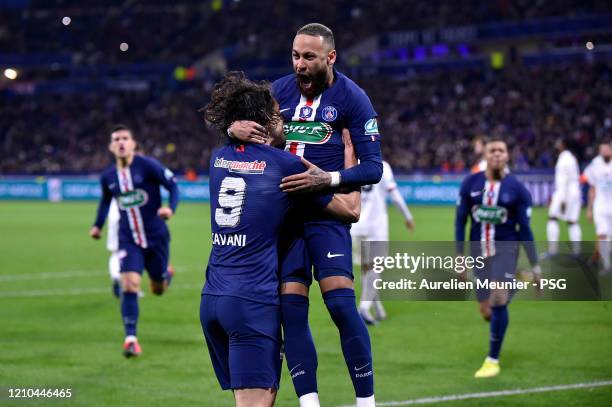 Neymar Jr of Paris Saint-Germain is congratulated by teammate Edinson Cavani after scoring during the French Cup Semi Final match between Olympique...