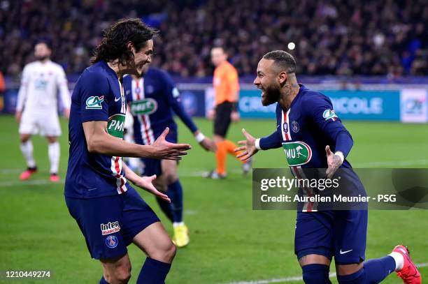 Neymar Jr of Paris Saint-Germain is congratulated by teammate Edinson Cavani after scoring during the French Cup Semi Final match between Olympique...