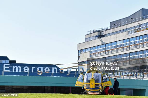 The Air Ambulance helicopter is pictured by the Emergency Department at Aintree Hospital in Liverpool, north west England on April 20 as life in...