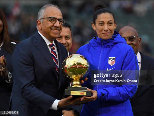 Christen Press of the United States receives the Scotiabank Golden Ball Award from Carlos Cordeiro, president of US Soccer, after the CONCACAF...