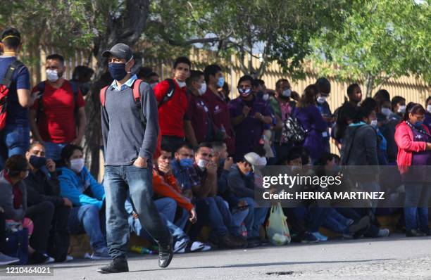 Factory workers halt their work to protest against the lack of safety measures against the novel coronavirus, COVID-19, outside Electrocomponentes of...