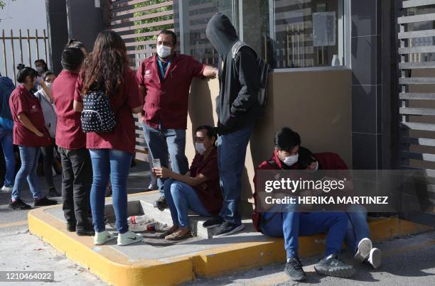 Factory workers halt their work to protest against the lack of safety measures against the novel coronavirus, COVID-19, outside Electrocomponentes of...