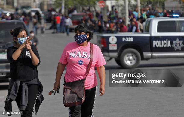 Factory workers halt their work to protest against the lack of safety measures against the novel coronavirus, COVID-19, outside Electrocomponentes of...